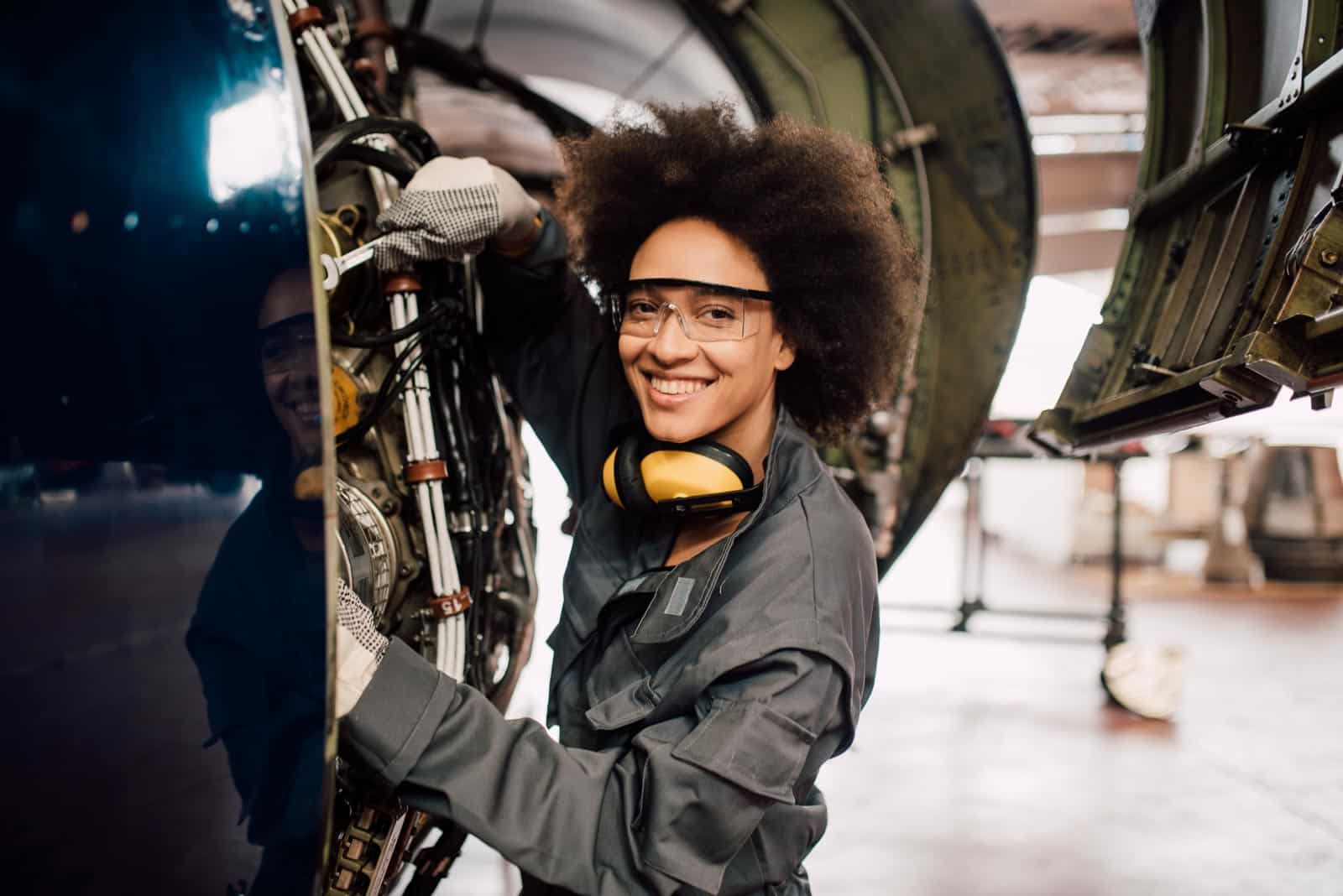 Woman smiling and working on a plane