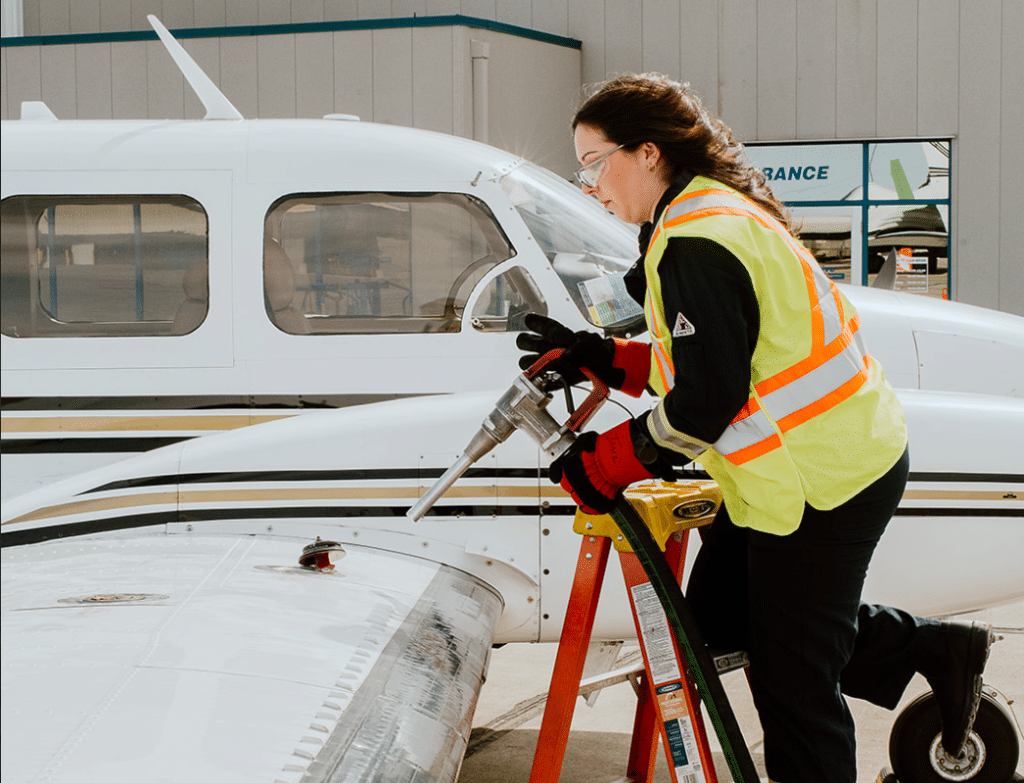 woman fuelling up an aircraft