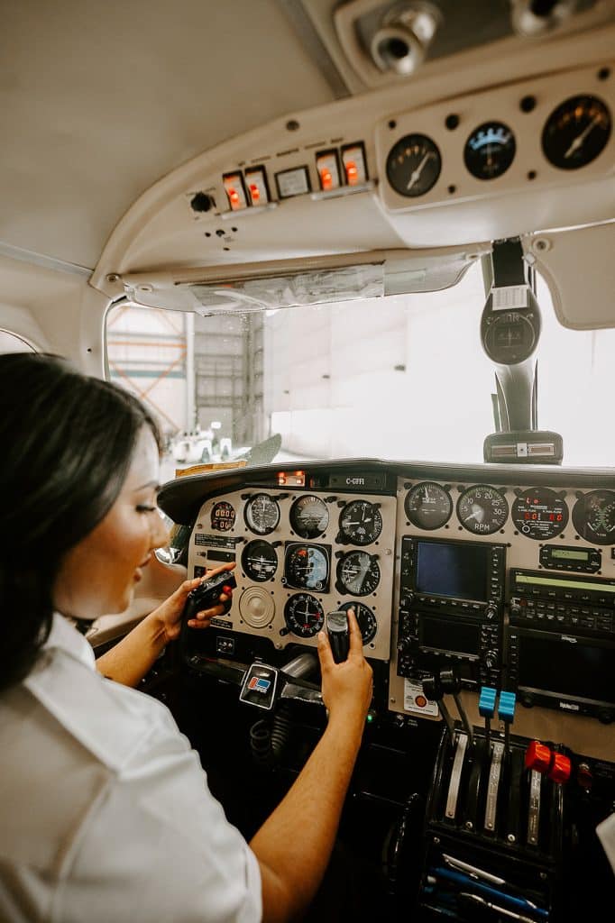 Women inside a private plane working as the pilot